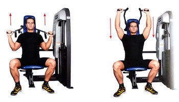 Жим прямым хватом сидя на тренажере